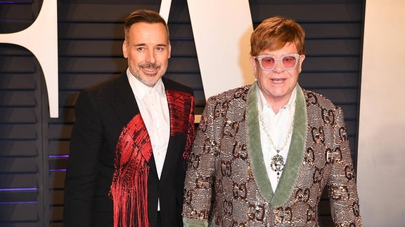 Elton John und David Furnish bei einer Veranstaltung