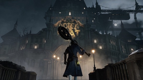 Screenshot eines Videospiels: Ein Mann mit einer Art Hammer geht auf ein riesiges viktorianisches Gebäude zu